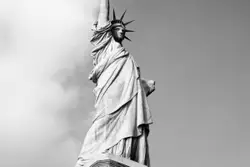 Statue Of A Man On Top Of A White And Black Horse