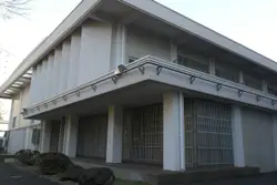 Building With A Large Window And A Large White Building
