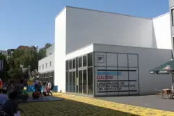 Large Building With A Sign On The Side Of It