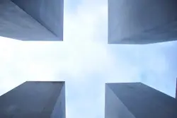 Building With A Large White Building Behind It