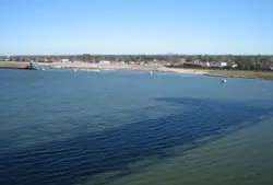 Large Body Of Water With A Boat On It