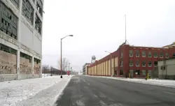 Street With A Building And A Street Sign