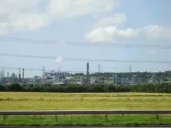 Field With A Fence And A Train On It