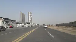 Large White Building With A Clock On It