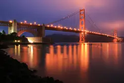 Bridge With A Train Going By It