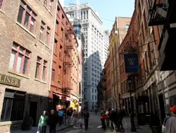 People Walking Down A Street