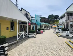 Row Of Wooden Benches On A Sidewalk