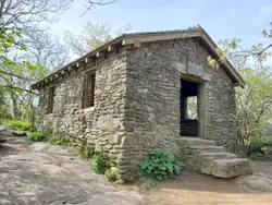 Stone Building With A Large Clock On The Side