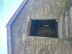 Small Building With A Bird On The Roof
