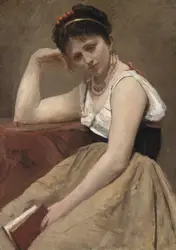 Woman Sitting On A Wall With A Book
