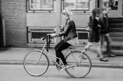 Man Riding A Bicycle On A Street