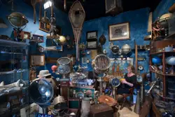 Room With A Bunch Of Different Types Of Items Hanging On The Wall