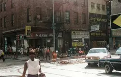 Street Scene With People Walking And Cars