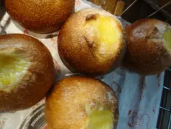 Pile Of Donuts On A Counter