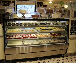 Bakery Display Case With A Variety Of Pastries On It