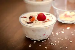 Bowl Of Fruit With Ice Cream And A Spoon