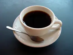 Cup Of Coffee On A White Plate