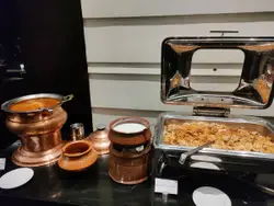 Counter Top With A Pot Of Food And A Stove Top
