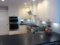 Kitchen With A Sink, Stove, And A Counter Top