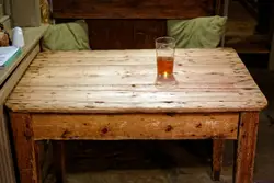 Wooden Table With A Glass Of Water On It
