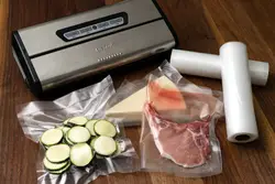 Table Topped With A Bag Of Food And A Knife