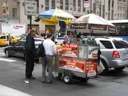 Man Standing In Front Of A Food Truck