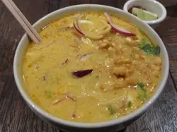 Bowl Of Soup With A Spoon And Chopsticks