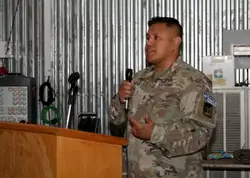Man In A Military Uniform Holding A Cell Phone