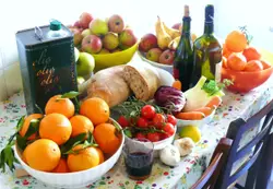 Table Topped With A Bowl Of Fruit And Vegetables