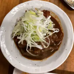 Plate Of Food With A Fork On A Table