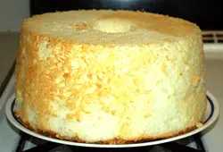 Cake With A White Frosting On Top Of It