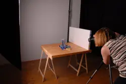 Woman Is Playing A Video Game On A Table