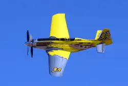 Small Yellow And Blue Plane Is Flying In The Air