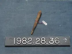 Baseball Bat Is On A Pole Near A Sign