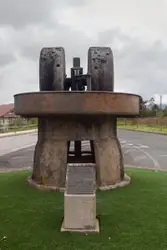 Statue Of A Man Sitting On A Bench