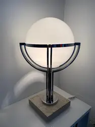 White Lamp Sitting On Top Of A White Wall