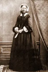 Woman In A Black Suit And A Black Hat