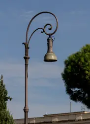 Street Light With A Street Sign On It