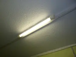 Dark Room With A Light On And A Wall With A Light