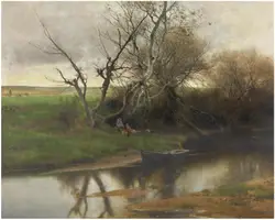 Person Sitting On A Bench Near A Body Of Water