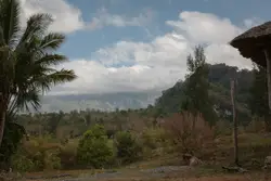Small Hillside With A View Of A Mountain