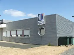 Large Building With A Large Advertisement On The Side