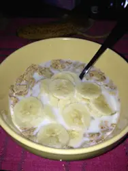 Bowl Of Cereal With A Spoon And A Bowl Of Fruit