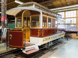 Train On A Train Track With A Wooden Bench