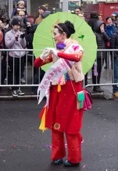Woman In A Red And White Striped Umbrella