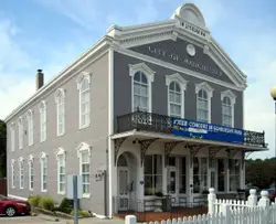 White And Black Building With A White And Black Clock On It