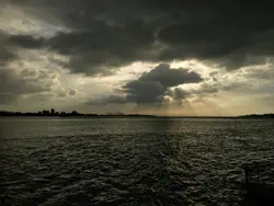 Sunset With A Boat In The Distance