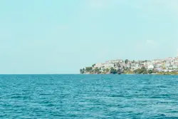 Large Body Of Water With A Mountain