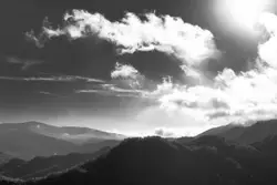 Mountain Range With A Cloudy Sky