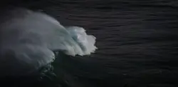 Surfer Is Riding A Wave In The Ocean